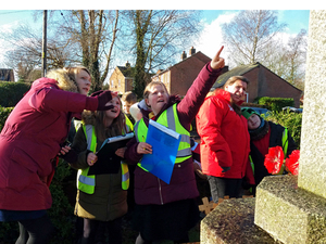Year 5 and 6 pupils from Cockshutt CofE Primary School looking at Cockshutt war memorial with WMT Learning Officer © Martin Phillips, 2019 